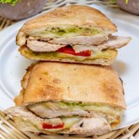Grilled Chicken Panini · Marinated grilled chicken, mozzarella cheese, roasted red peppers, with pesto sauce.