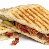 Meatless Panini · Grilled sandwich with fresh mozzarella cheese, plum tomatoes, fresh basil, spinach, sun drie...