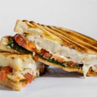 Chicken Fajitas Panini · Grilled sandwich with grilled chicken, cheddar cheese, roasted peppers, caramelized onions, ...
