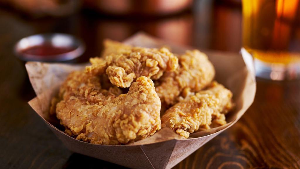 Chicken Tenders · Golden crispy tenders with white chicken meat inside.
