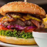 The Bbq Bacon Cheeseburger · Juicy beef patty with melted cheese, crispy bacon strips, sweet BBQ sauce, lettuce, tomatoes...