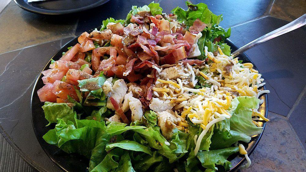 Mike & Jay'S Salad · Romaine lettuce tossed with grilled chicken, broccoli, bacon and tomato with a creamy honey mustard dressing.