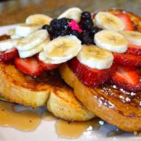 French Toast · Cinnamon raisin or thick sliced egg bread served with home fries.