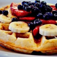 Belgian Waffle · Served with bananas and strawberry, topped with whipped cream