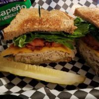 Turkey Club · Bacon lettuce and tomato served with a side salad.