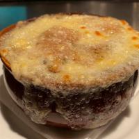 Classic French Onion Soup · Soup that is made with stock onions and covered with either cheese bread or croutons.