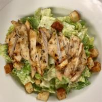 Caesar Salad · Crisp romaine lettuce tossed with our home-made Caesar dressing, parmesan cheese, and crouto...