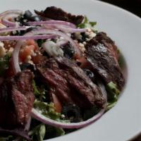 Skirt Steak Salad · Mixed greens, crumbled blue cheese with house vinaigrette dressing.