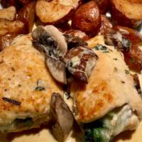 Chicken Rollatini · Stuffed with spinach and mozzarella in a creamy brandy sauce with Portobello mushrooms.