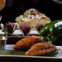 Empanadas · Two fried deep fried patties filled with your choice of preparation.