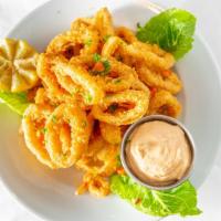 Calamari Frito · Tender calamari lightly floured and deep fried. Served with chipotle-mayo creamy sauce.