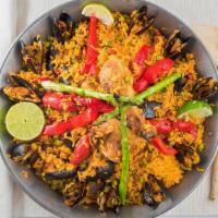 Paella Mexicana · Seafood and meat combination, shrimp, clams, mussels, calamari, imported Spanish chorizo, ch...