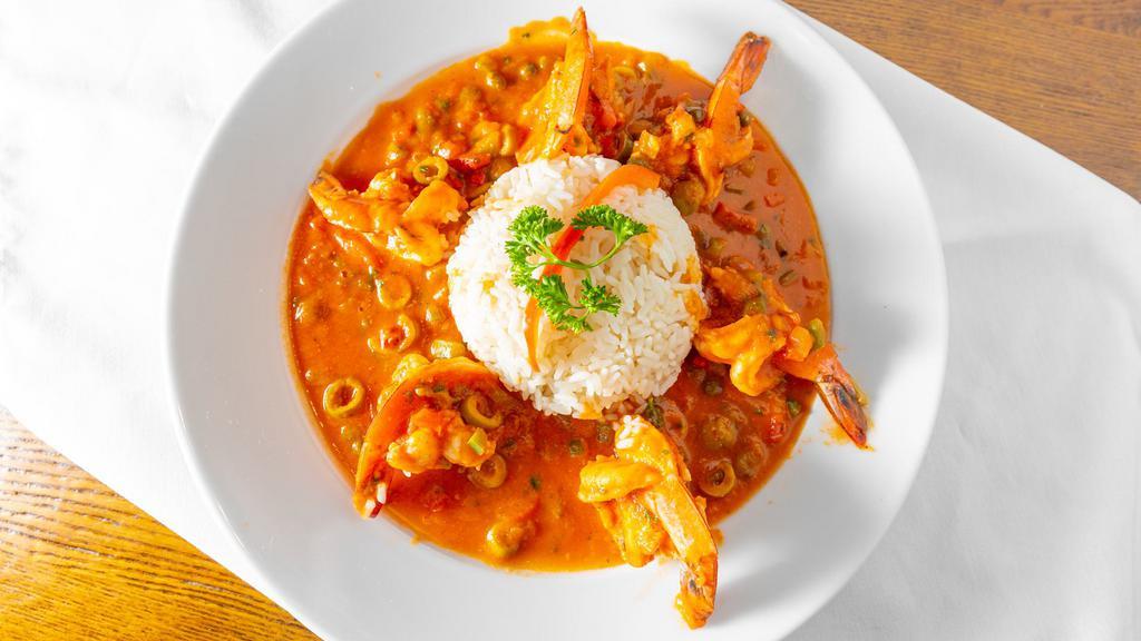 Camaron Veracruz · Jumbo shrimp in tomato white wine sauce mixed with olives, capers, green peppers, onions and a hint of chipotle adobo, 
served with white rice and house salad.