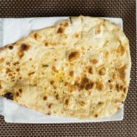 Sesame Naan · Whole flour bread stuffed with dry fruits and topped with sesame.
