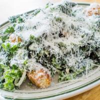 Kale Caesar Salad · Garlic croutons and parmesan dressing.