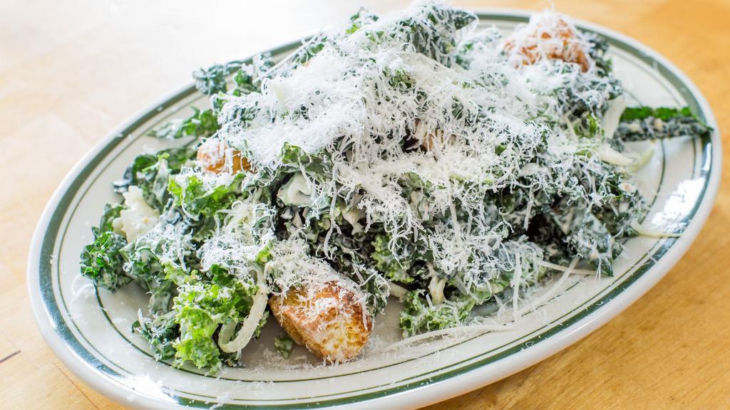Kale Caesar Salad · Garlic croutons and parmesan dressing.