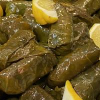 Grape Leaves Stuffed With Rice · On a bed of garden salad.