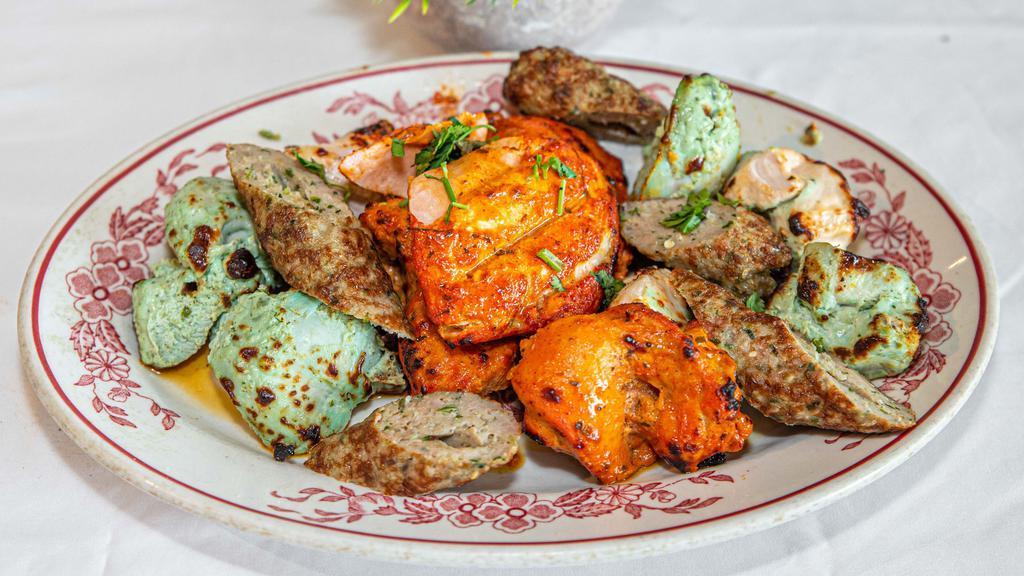 Tandoori Mixed Grill · Combination of tandoori chicken, seekh kebab, hariyali, malai kebab and salmon.