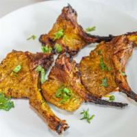 Lamb Chops · Marinated lamb chops cookie in clay oven.