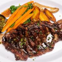 Sirloin · served with sauteed seasonal vegetables, oven-roasted potatoes, carrot puree, garlic cilantr...