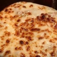 French Onion Soup · Bowl of our French Onion Soup topped with Swiss and mozzarella cheeses