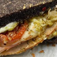 The Inketoble Turkey Sandwich · This Turkey sandwich is served on fresh baked bread with provolone, pesto Mayo and roasted t...