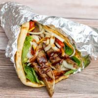 Lamb Gyro · Grilled Lamb Gyro served toasted Pita bread with house salad and your choice of white sauce,...