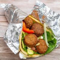 Falafel Sandwich  · Falafel served on house salad and a toasted pita bread with your choice of white sauce and /...