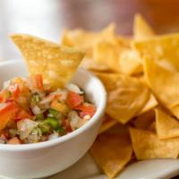 Pico De Gallo · Fresh chopped tomatoes, onions, coriander leaves, jalapenos, and splash of 
lime served with...