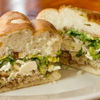 Torta · White bread filled with (ONE CHOICE OF PROTEIN) onions/coriander leaves, 
lettuce, quesillo,...