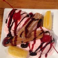 Texas Special Dessert · Mexican churro with ice cream. Topped with fresh fruit and choice of strawberry, caramel or ...