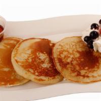 Pancakes · Three freshly-made pancakes served with your choice of syrups and fudge.