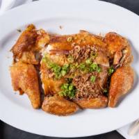 Cantonese Roast Chicken · Crispy skin, organic chicken, garnished with crispy garlic and shallots.