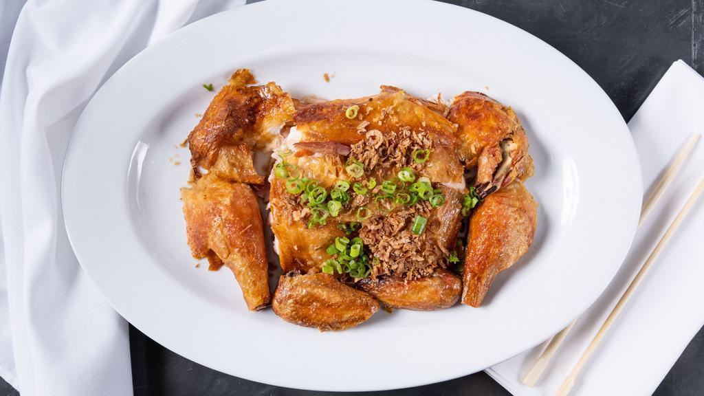 Cantonese Roast Chicken · Crispy skin, organic chicken, garnished with crispy garlic and shallots.
