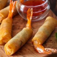 Prawn Rolls · Deep-fried shrimp marinated in garlic and pepper wrapped in spring rolls skin and served wit...