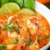 Tom Yum · Hot & spicy. Shrimp or chicken and mushroom, bell pepper in spicy lemon grass soup with a sq...