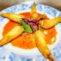 Shrimp In A Blanket · Deep fried shrimp with stuffed shrimp wrapped in a crispy spring roll served with mild spicy...