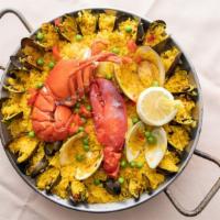 Paella Valenciana · 1/2 Maine Lobster, Shrimp, Scallops,Mussels,Clams, Chorizo, Pork & Chicken