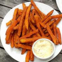 Sweet Potato Fries · Fresh sweet potatoes, cut into slices, and salted and fried to perfection.