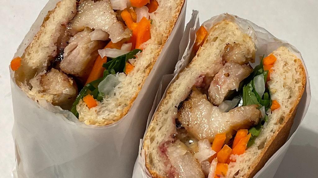 Pork Belly Banh Mi · Braised and Caramelized Pork Belly w/ pickled radish/carrots, cucumber, tomatoes, cilantro, jalapeno, housemade mayo , pork pate, on ciabatta bread.