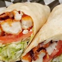 Chicken Ranch Wrap · Crispy Chicken tenders wrapped in a warm tortilla and topped with crispy bacon, fresh lettuc...