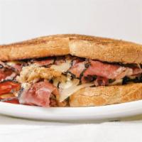 The Reuben · Choice of corned beef, pastrami or roast turkey with. sauerkraut, Swiss cheese and Russian d...