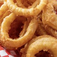 Onion Rings · Thick cut rings/beer butter/serve with blooming onion sauce.