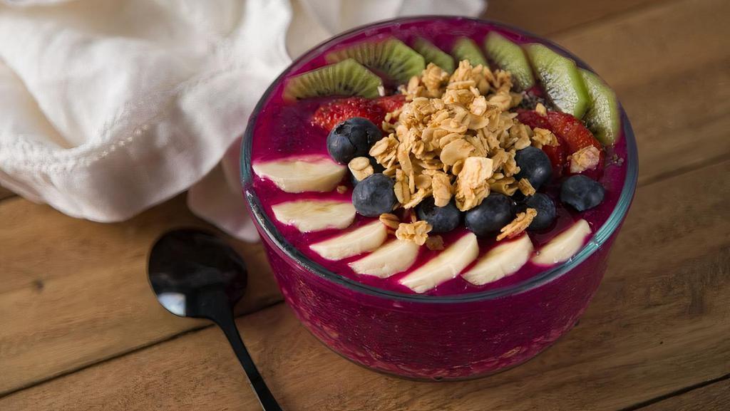 Pitaya Berry Bowl · Pitaya, granola, almonds, honey, blueberry, strawberry, banana, coconut.