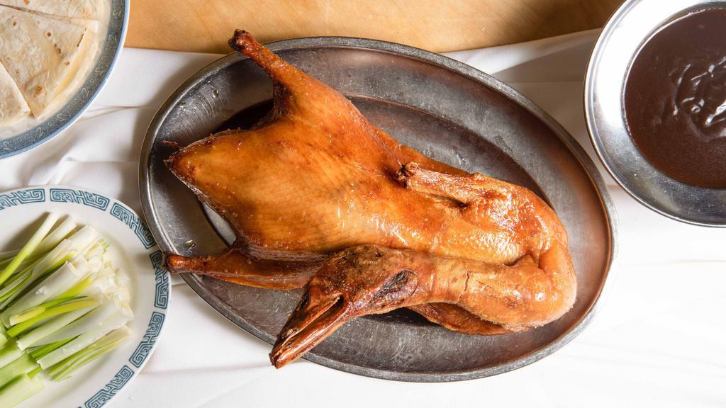 Peking Duck · Whole duck served with house-made pancakes, green scallions, fresh cucumbers, and special hoisin sauce.