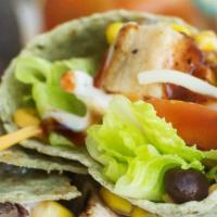 Bbq Chicken Wrap · Grilled Chicken, Mixed Greens, Black Beans, Corn, Red Onions, Shredded Cheese, BBQ Sauce, Fl...