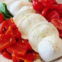 Caprese Salad · Fresh buffalo mozzarella imported from Campagna, Italy, served with wood-fired roasted tomat...