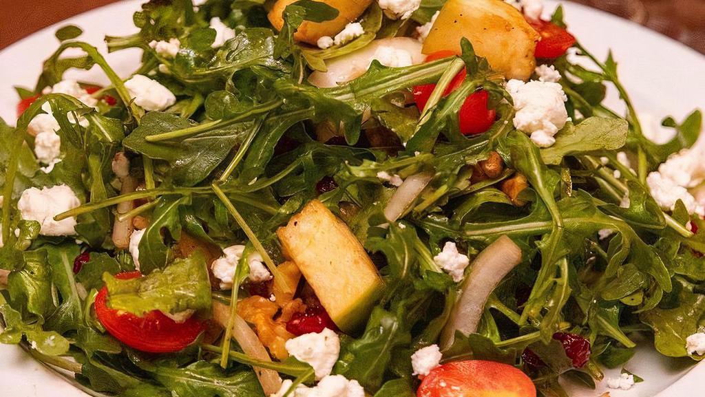 Arugula Salad · Arugula, tomatoes, onions, green apples, cranberries, walnuts, and goat cheese, tossed with balsamic vinegar and olive oil.