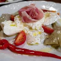 Burrata Salad · Served with prosciutto di Parma, roasted peppers, long stem artichoke hearts, and cherry tom...