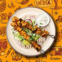 Chicken Triumph · Succulent morsels of chicken, marinated in tandoori masala and yogurt, cooked in an Indian c...